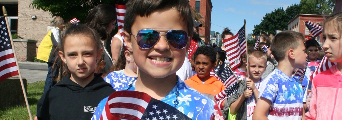 boy holding flag