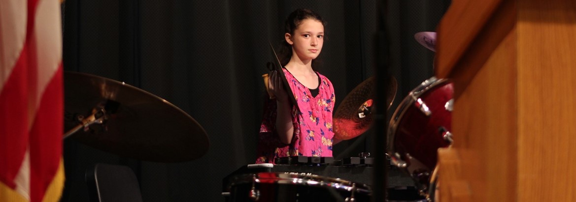 girl playing cymbals