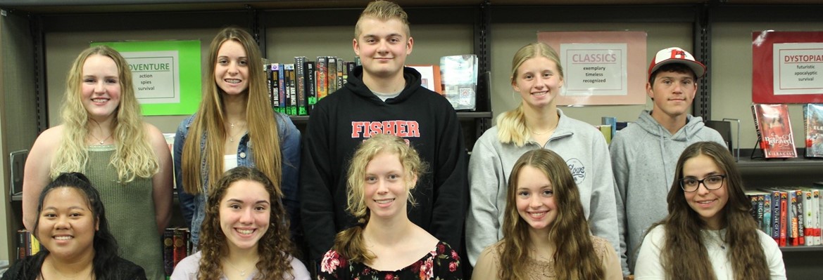 seniors sitting or standing in library