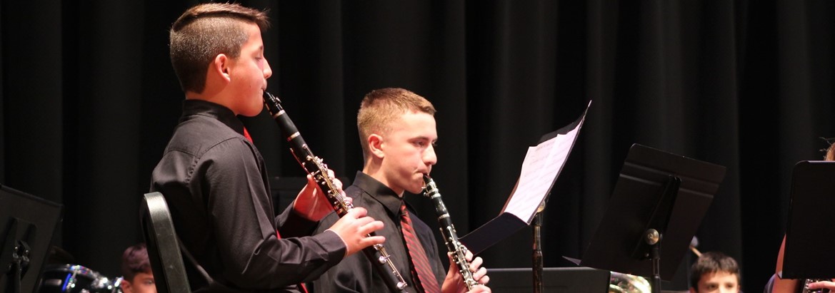 two boys playing clarinet
