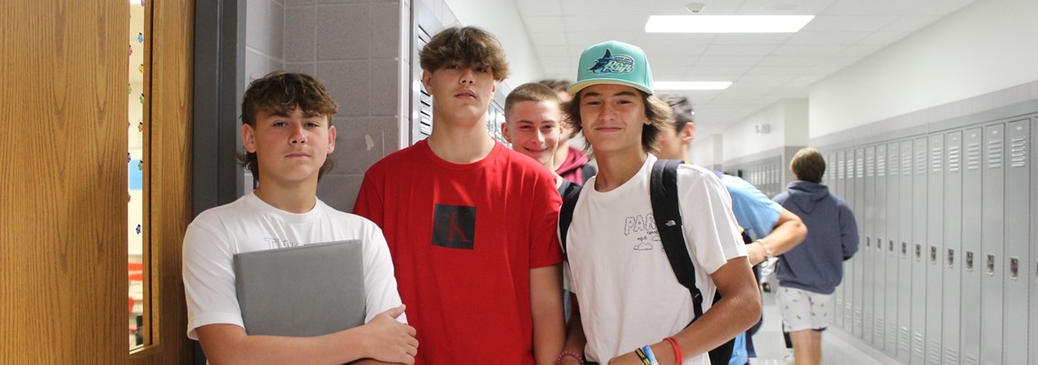 boys standing in hallway