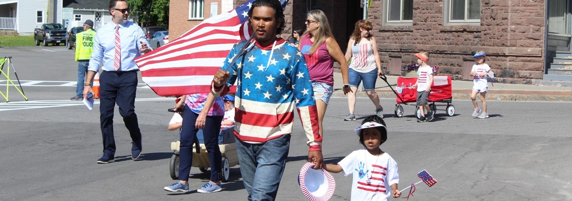 people walking in parade for flag day