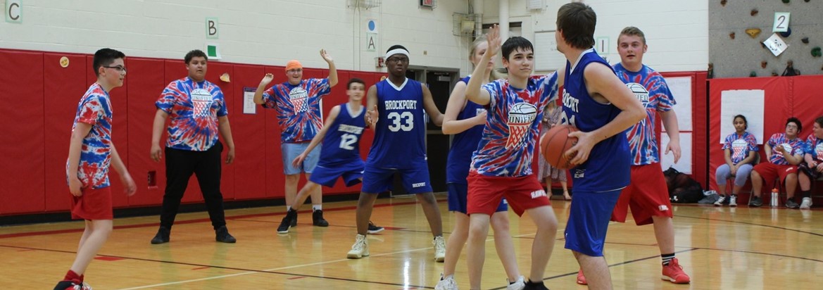 unified sports team playing basketball
