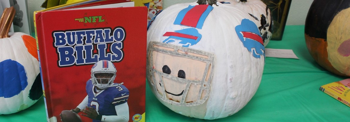 books and decorated pumpkins