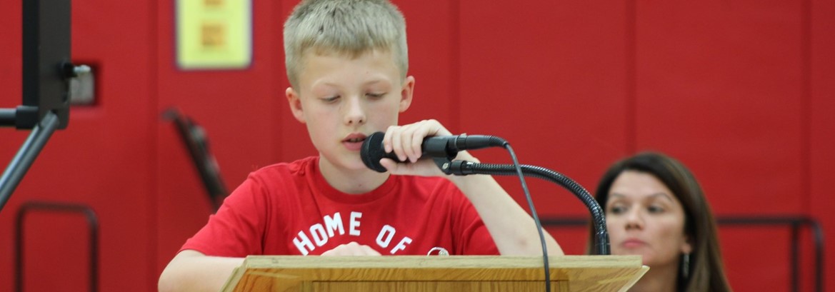 student at microphone