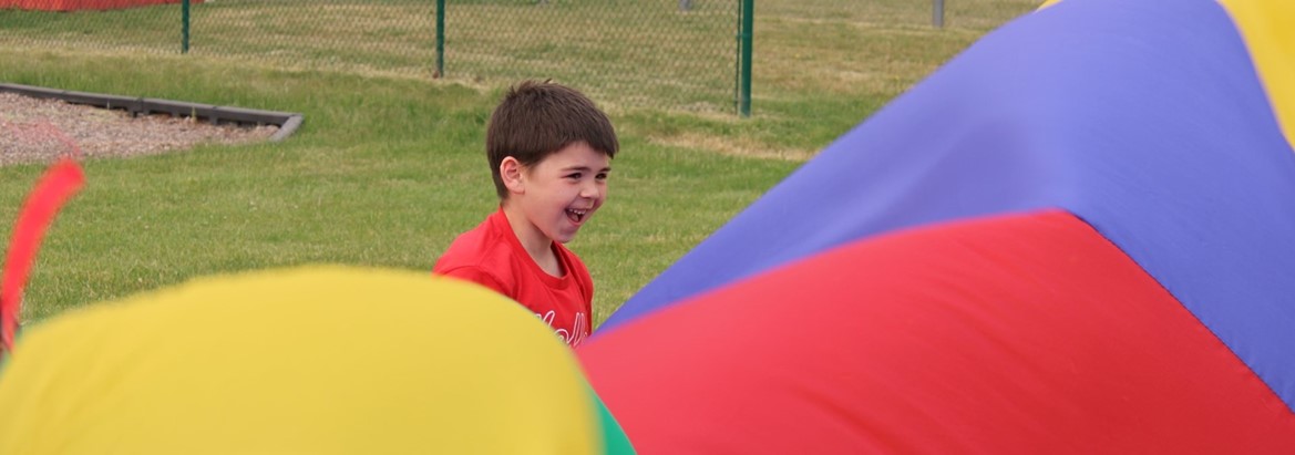 boy playing with parachute 