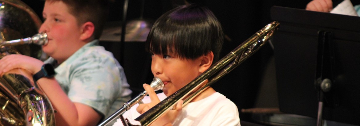 student playing trombone
