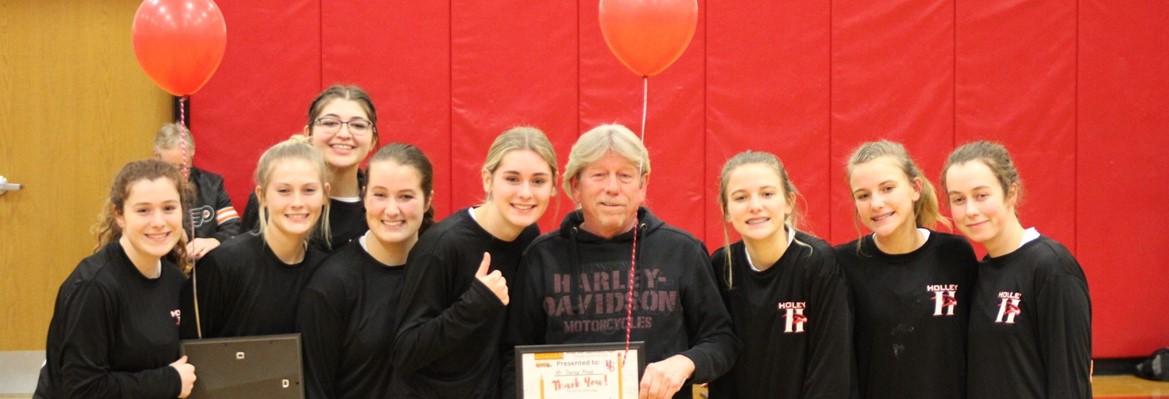grils basketball team with bus driver