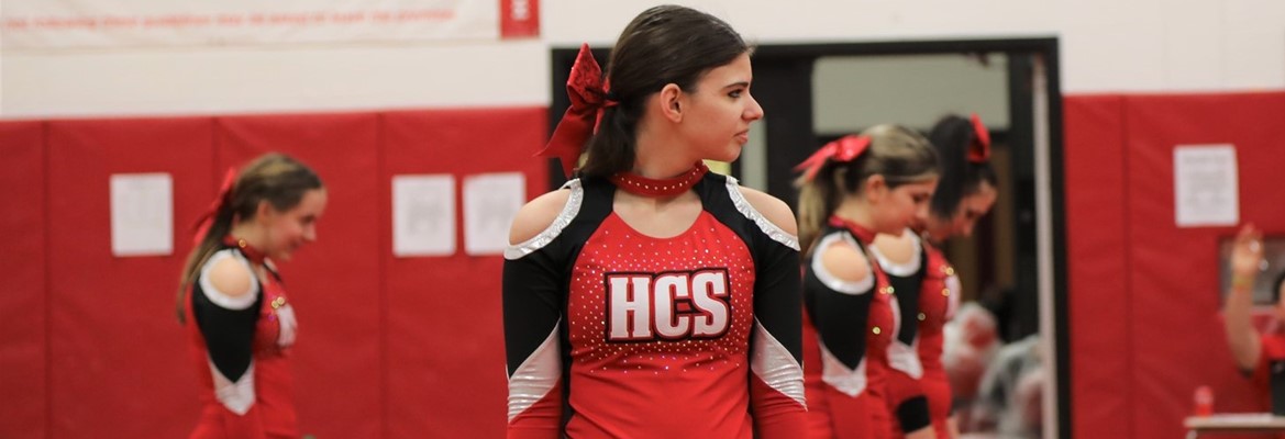 student performing cheerleading routine