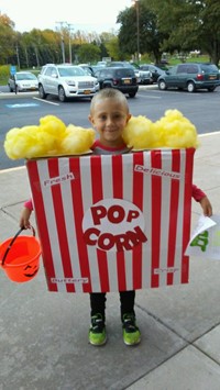 boy in popcorn box costume